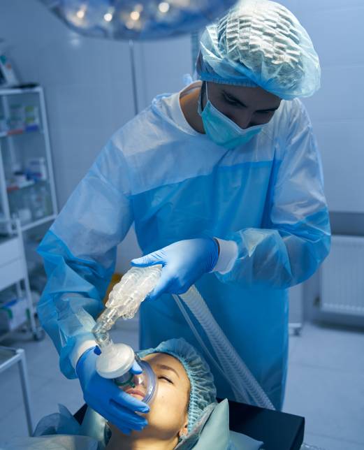 Medical worker maintaining general anesthesia before the surgery